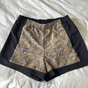 Comfortable, elastic pull on short, with charcoal and mustard yellow print.